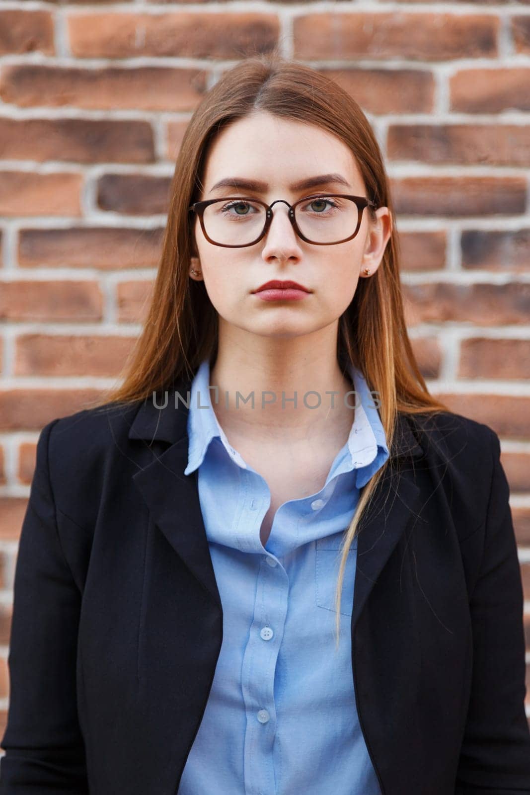 Portrait of beautiful business woman wearing glasses.