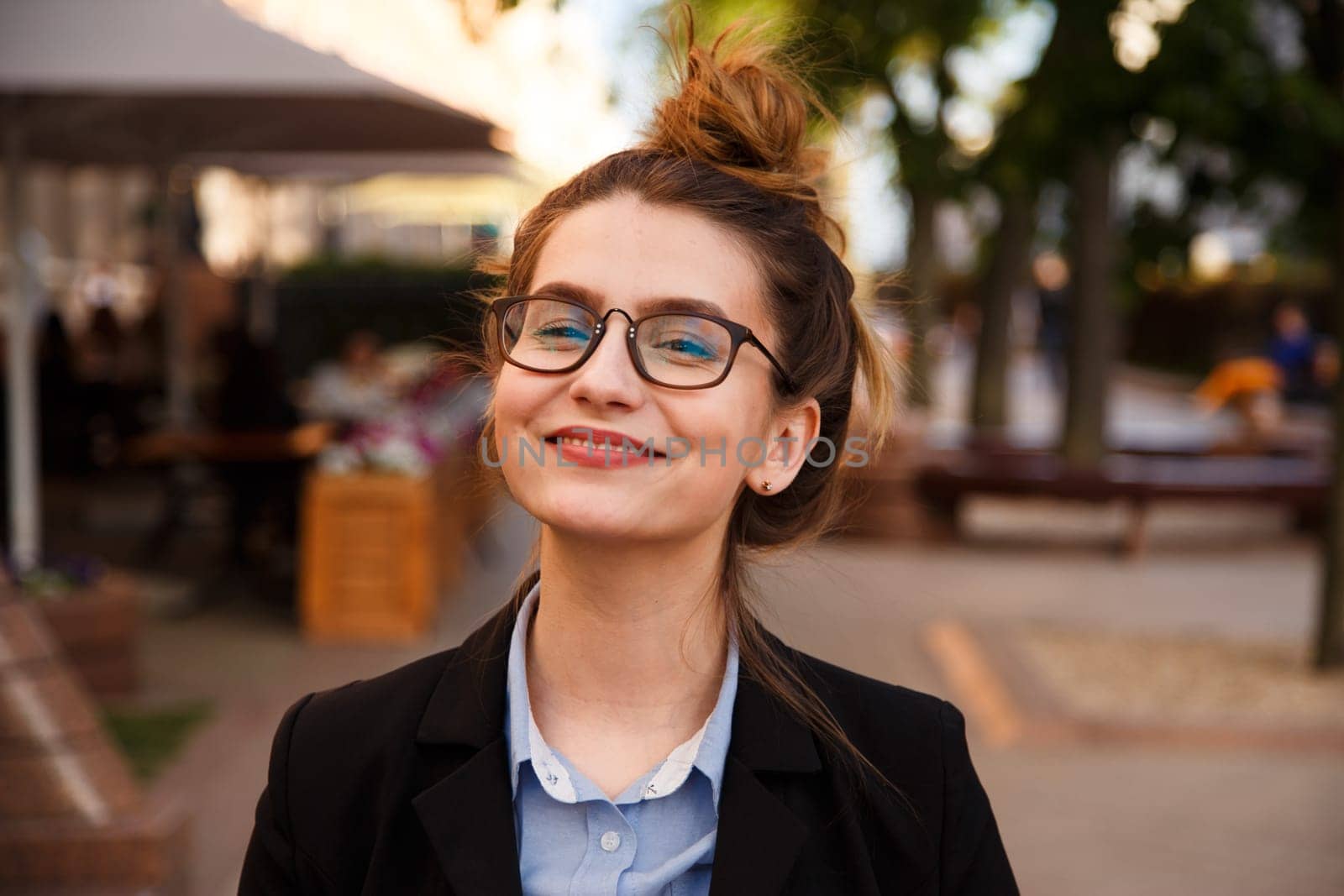 Business woman in suit portrait during travel for company meeting outdoor brunette with glasses