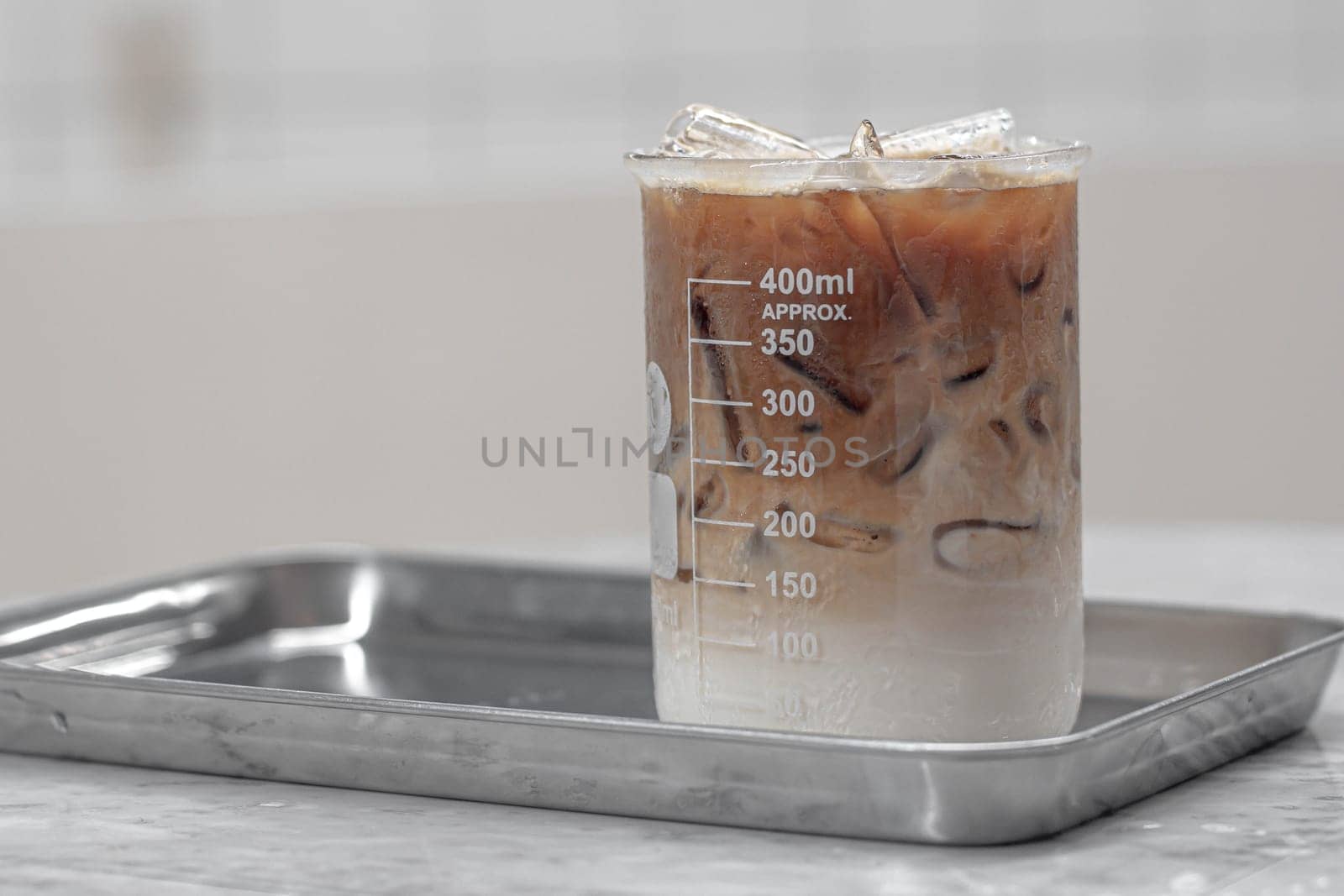 Beverage drinks come in a beaker. Cocktail served in a laboratory beaker at a science-themed bar. Chemistry bar Beaker Cocktail Glass Set