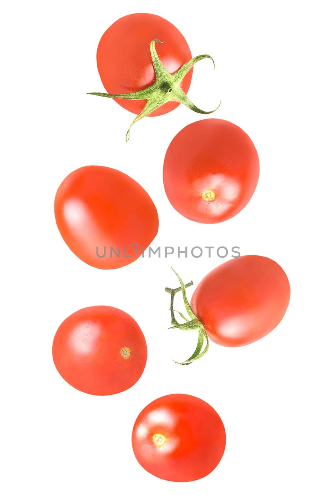 Isolated vegetables. Six whole tomatoes in the air on white with clipping path as package design element. Full depth of field. Food levitation concept