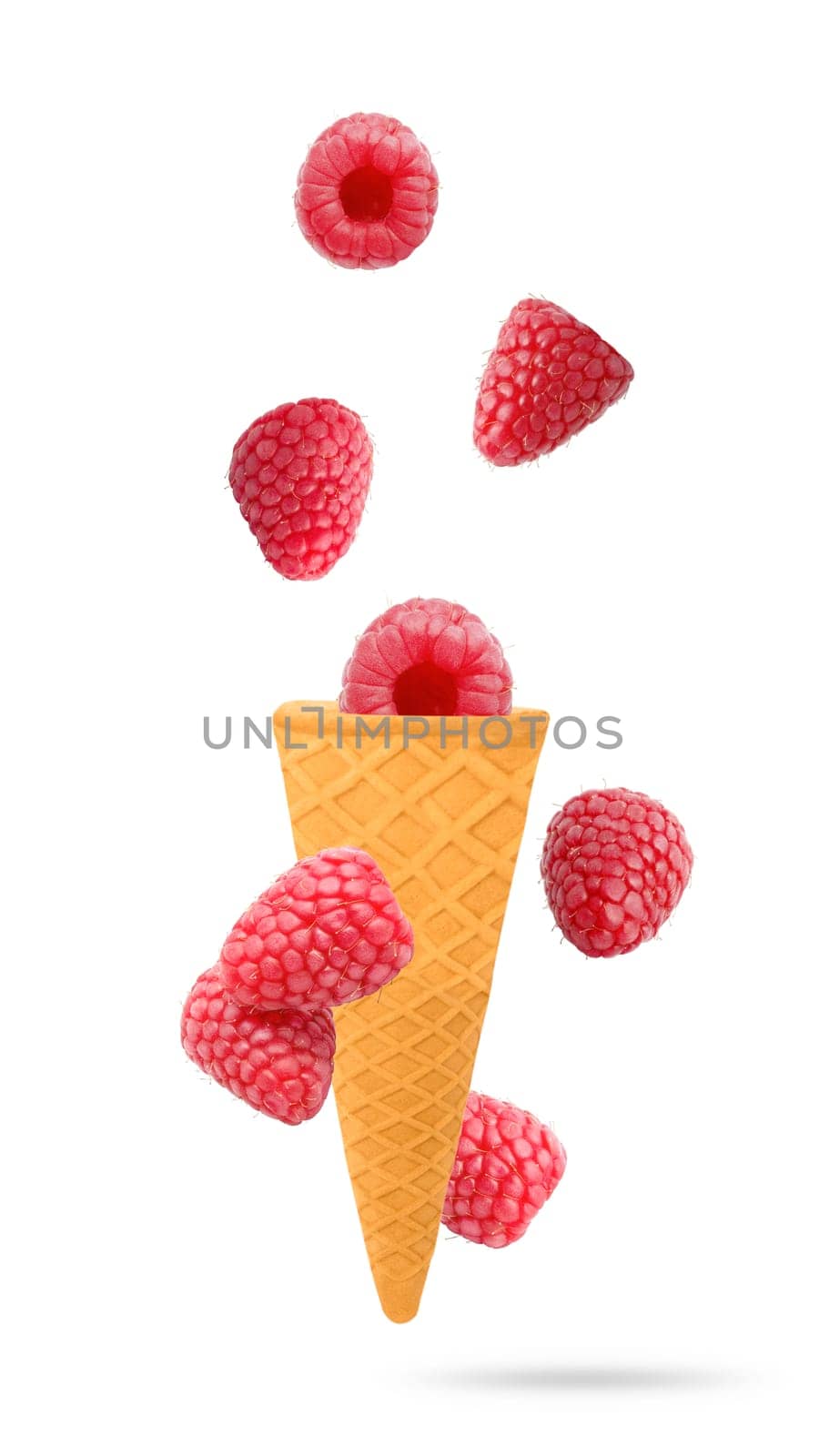 Isolated flying fruit. Eight Raspberry fruits falling down in ice cream cone with clipping path. Accurate retouching fruits for package design element. Full depth of field. Food levitation concept.