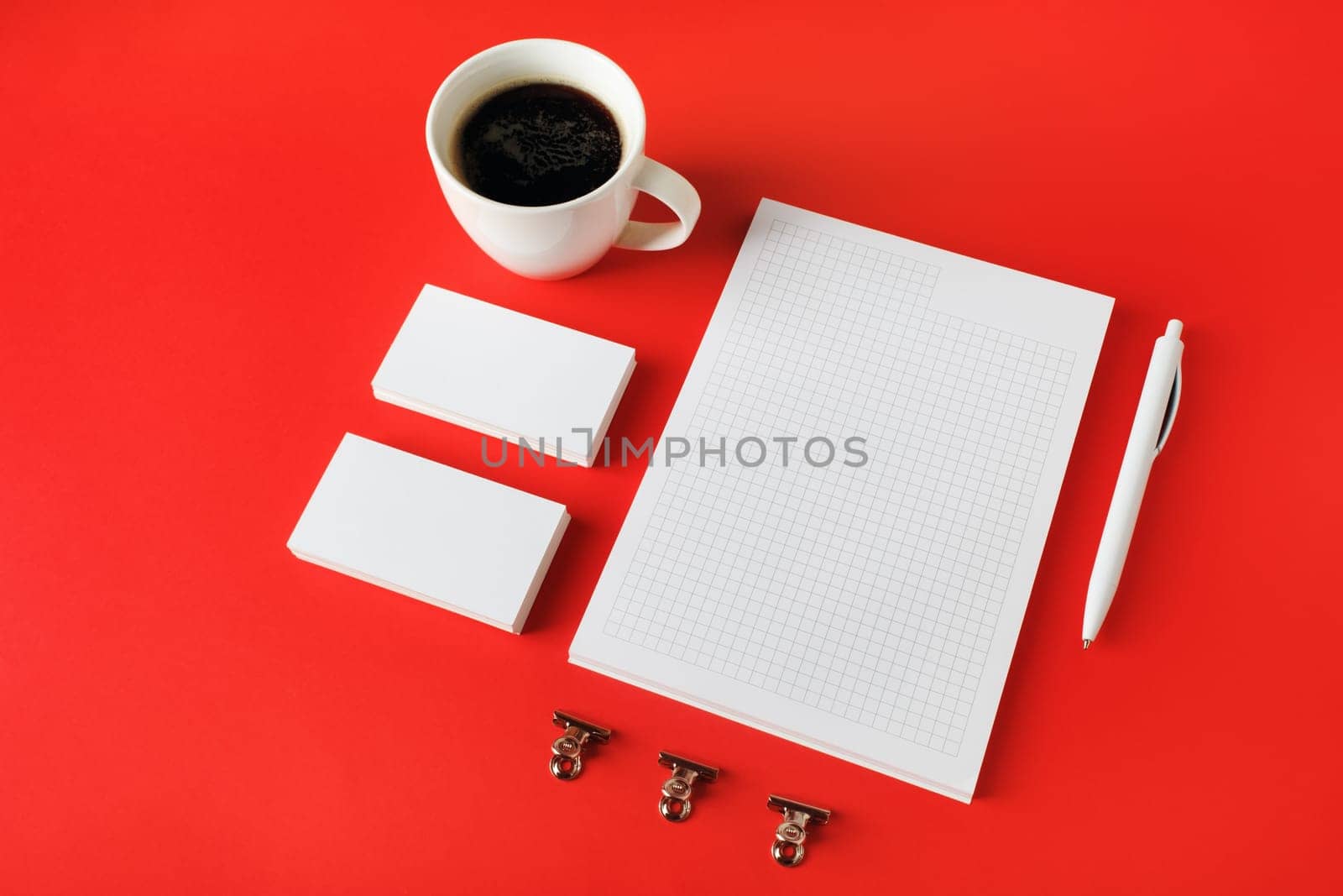Blank corporate stationery set on red paper background. Template for branding design. Branding mock up.