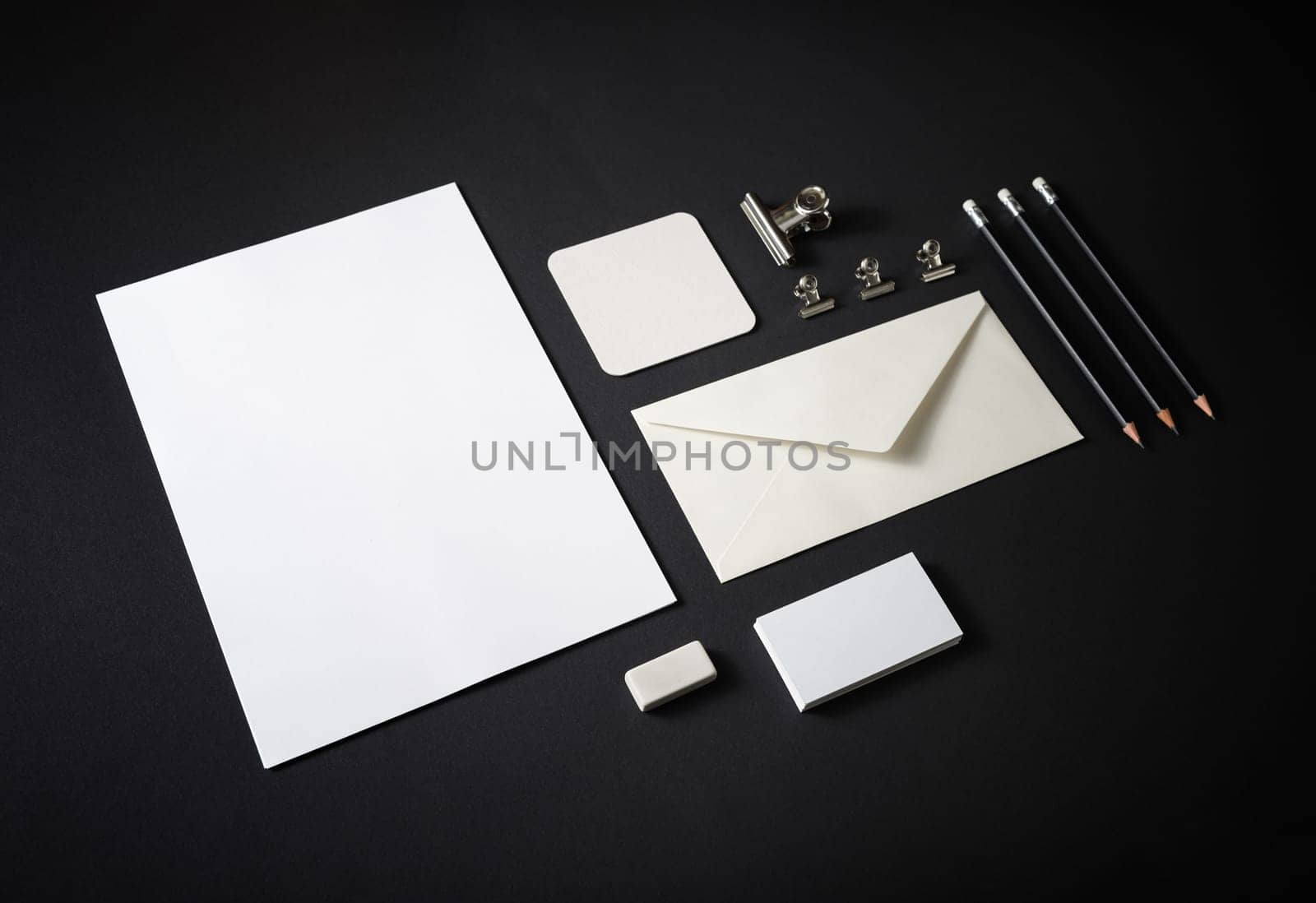 Stationery mock up on black paper background. Responsive design template. Branding identity mock up.