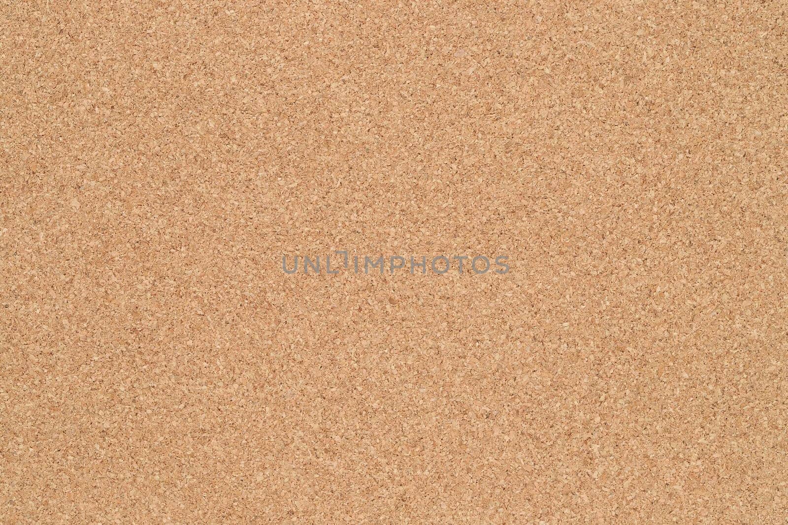Empty blank cork board or bulletin board. Close up of corkboard texture
