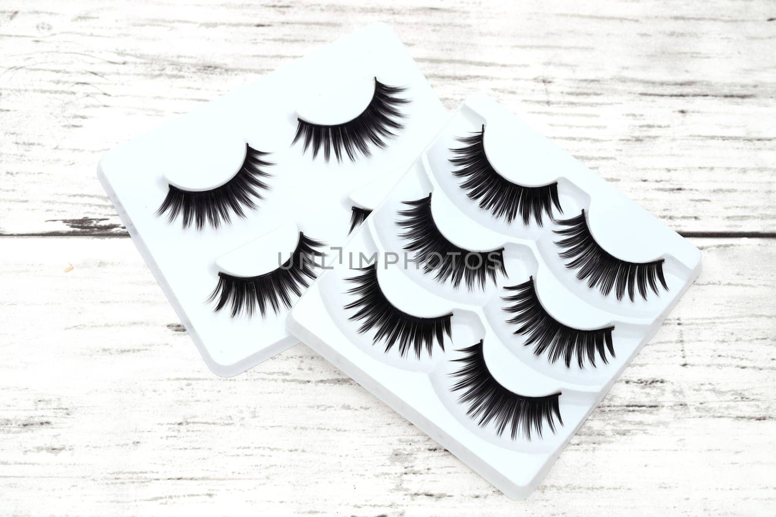 group of false eyelashes on white table