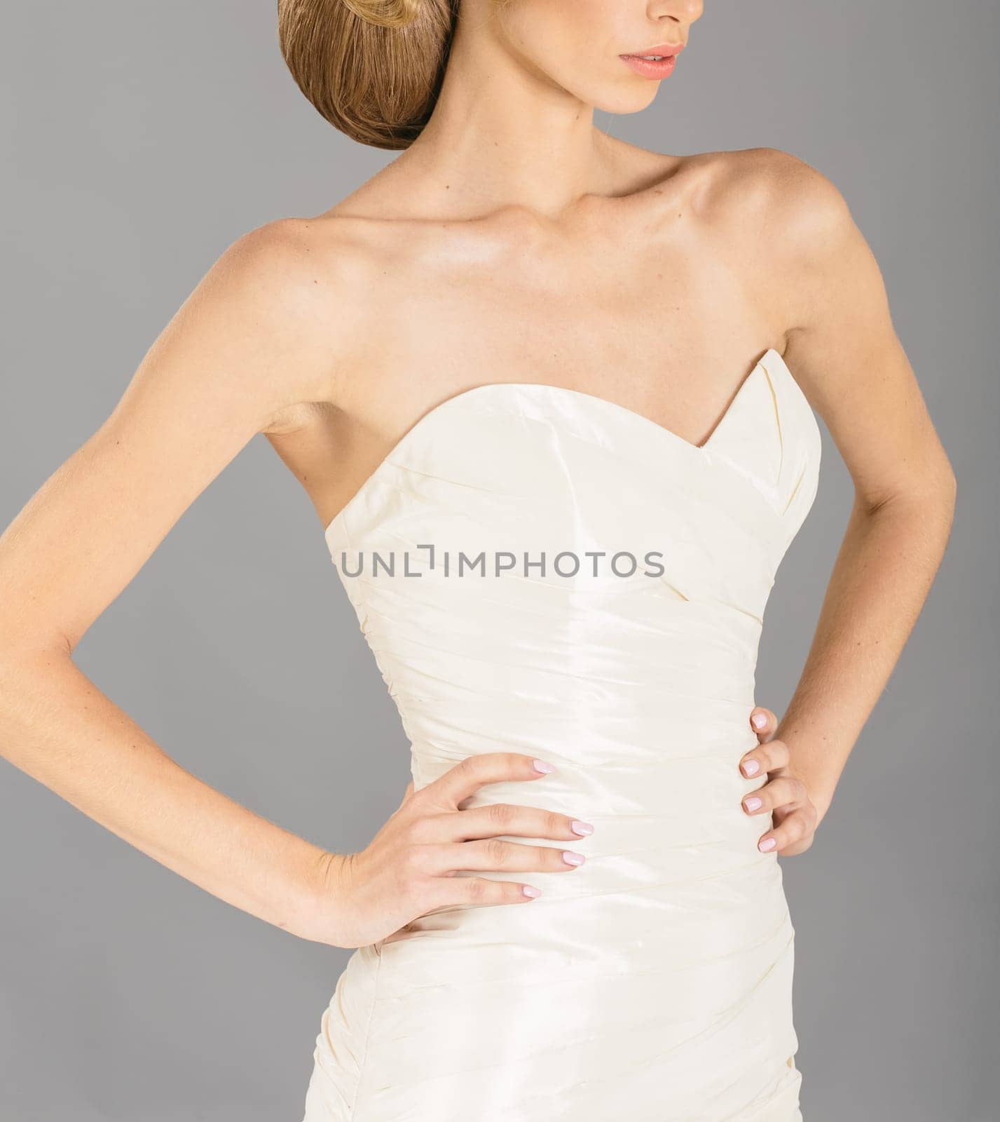 Beautiful bride on grey background. Studio shot