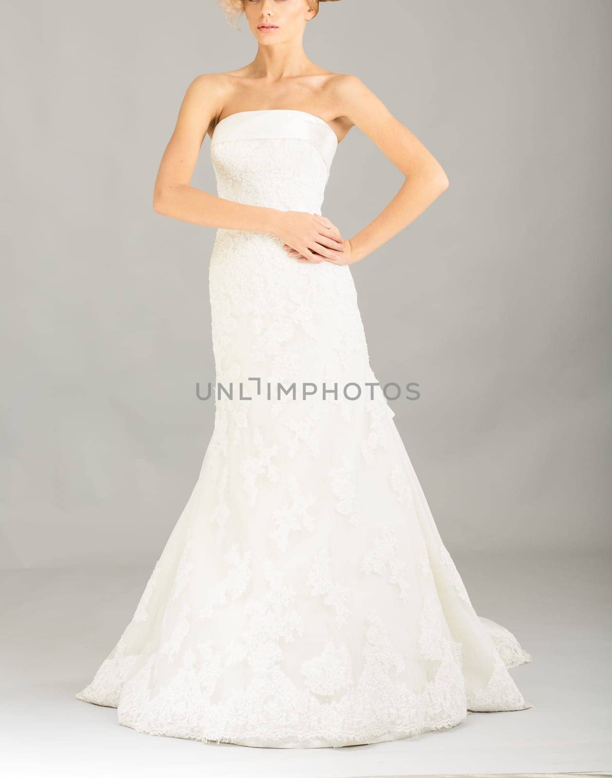 Beautiful bride on grey background. Studio shot