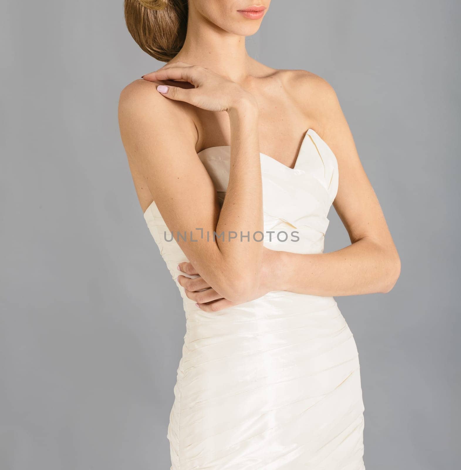 Beautiful bride on grey background. Studio shot
