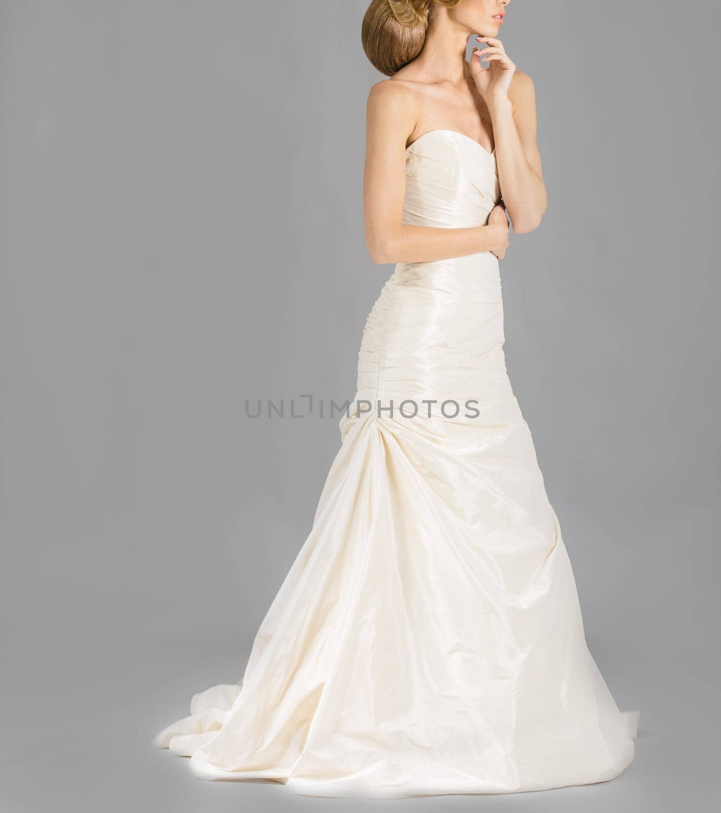 Beautiful bride on grey background. Studio shot
