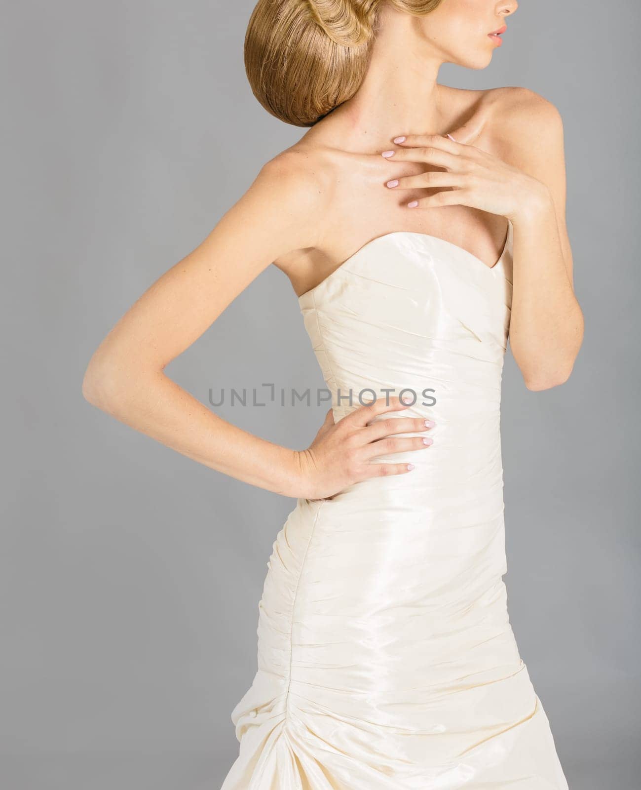 Beautiful bride on grey background. Studio shot