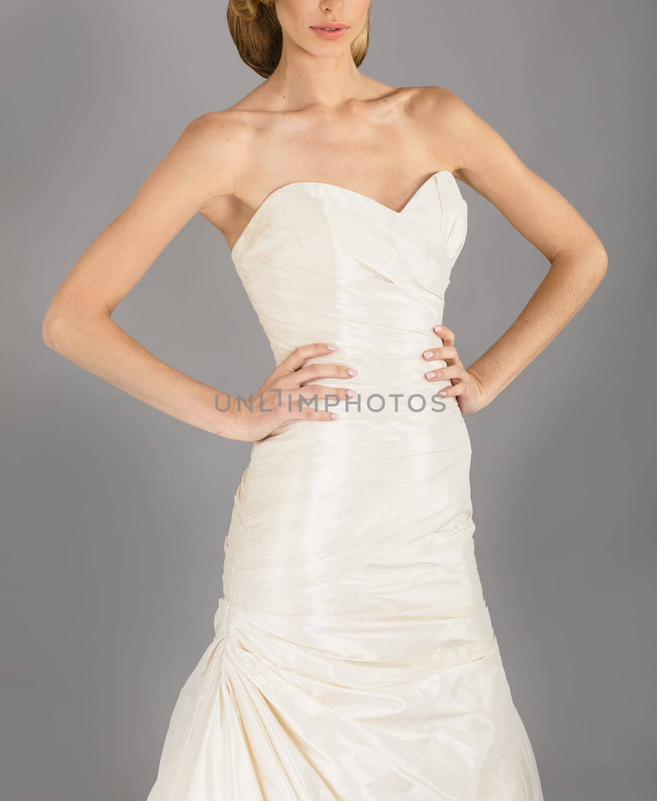 Beautiful bride on grey background. Studio shot