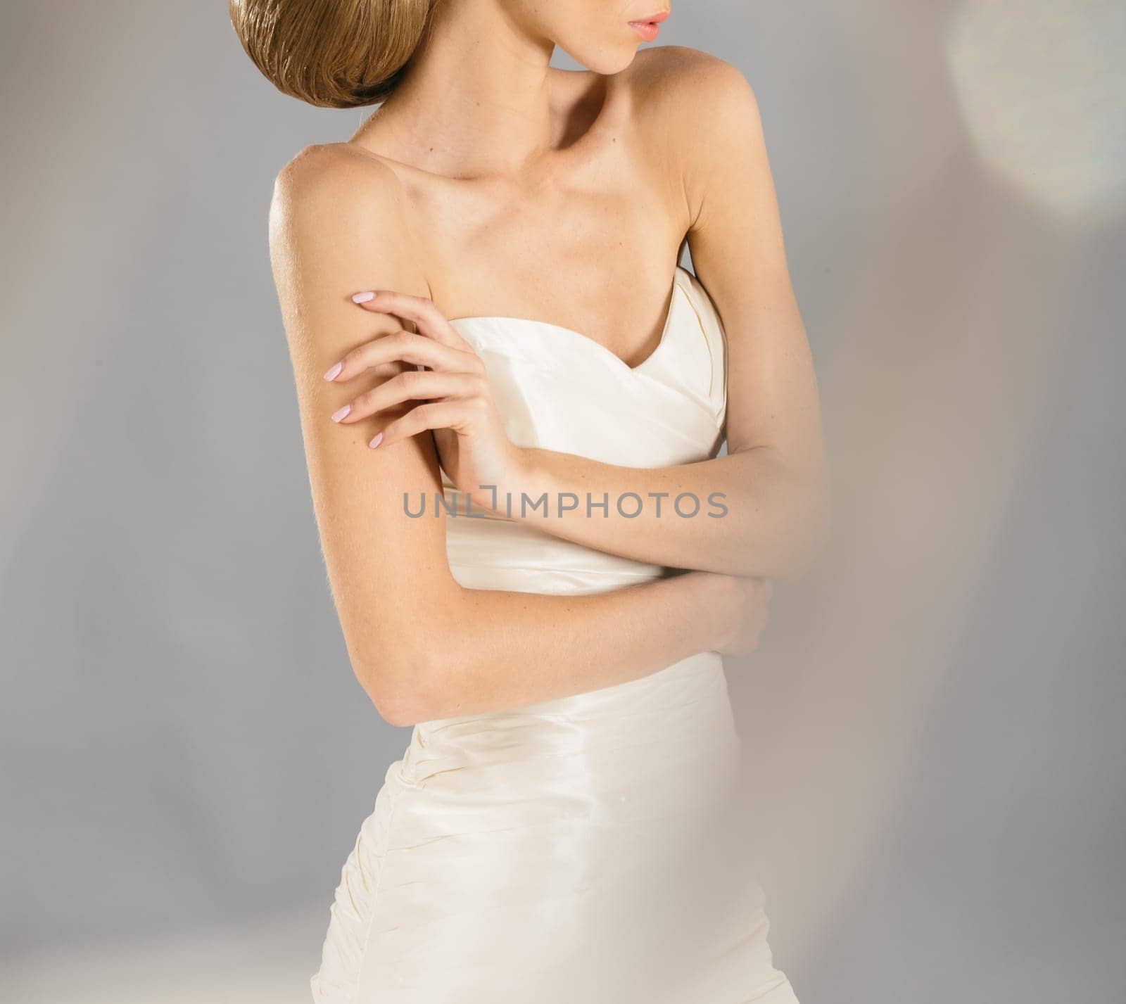 Beautiful bride on grey background. Studio shot