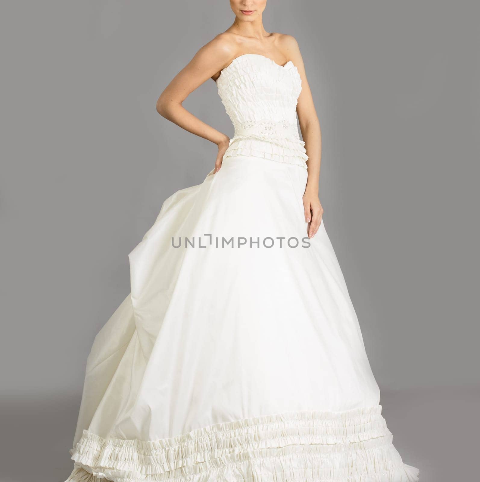 Beautiful bride on grey background. Studio shot