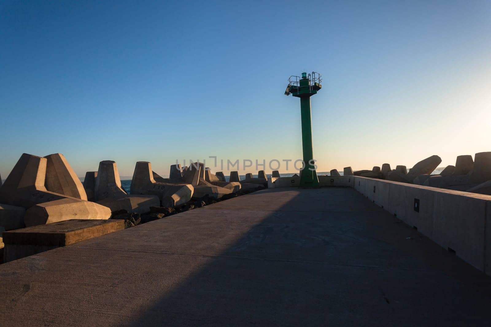 Harbor port beacon safety light structure  end of concrete pier for ships safety .