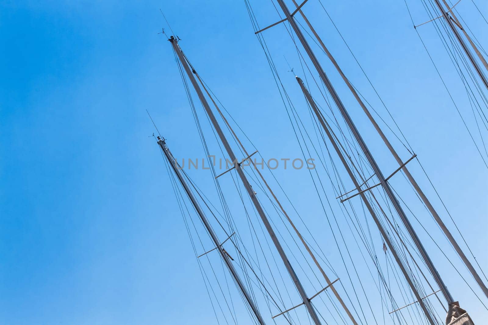 Sailing Must and Blue Sky, Particular of sailing must in a touristic harbor