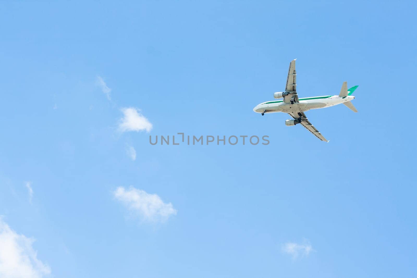 Image of Plane lands with blue sky and clouds