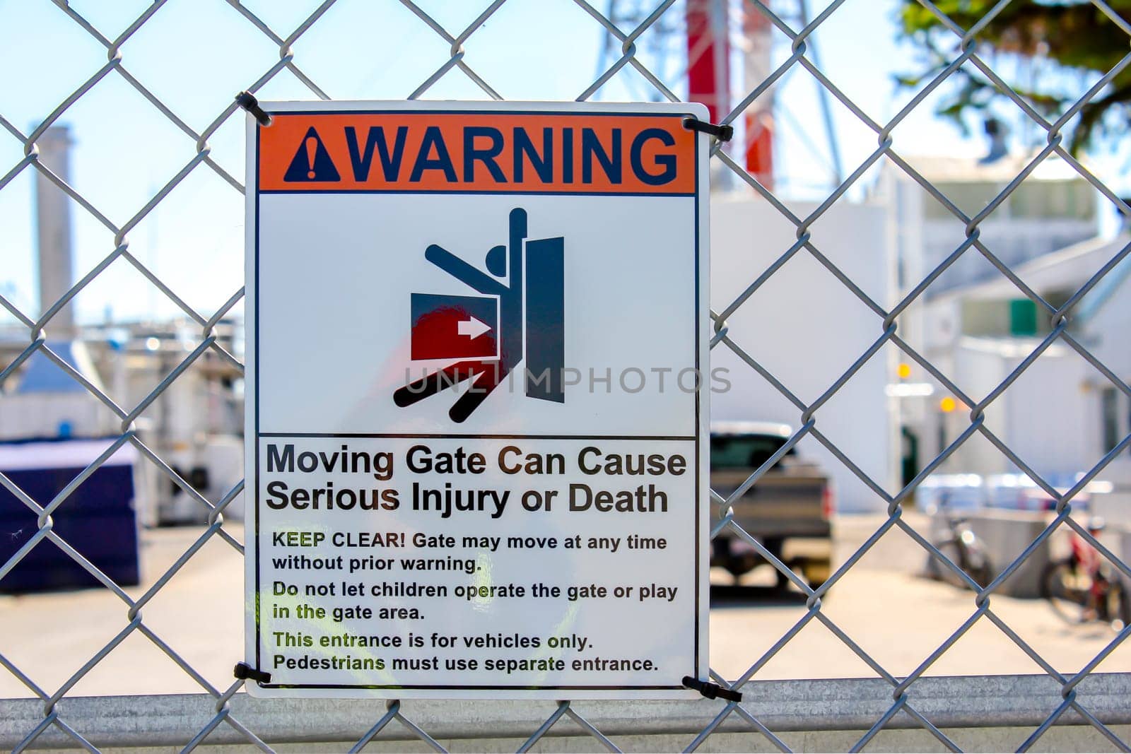 Warning Sign, Moving gate can cause serious injury or death message. Electric door sign.