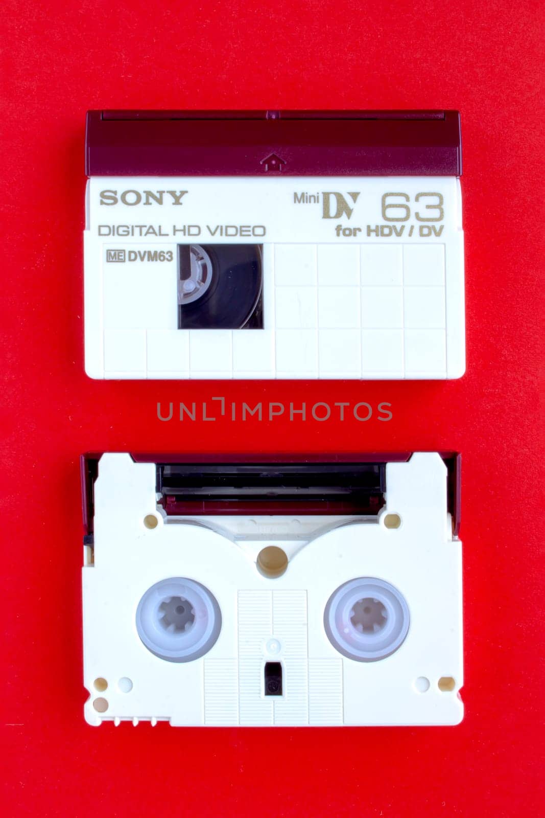Calgary, Alberta, Canada. Feb 13, 2021. A SONY Digital HD Video, mini DV for HDV/DV Cassette on a red background