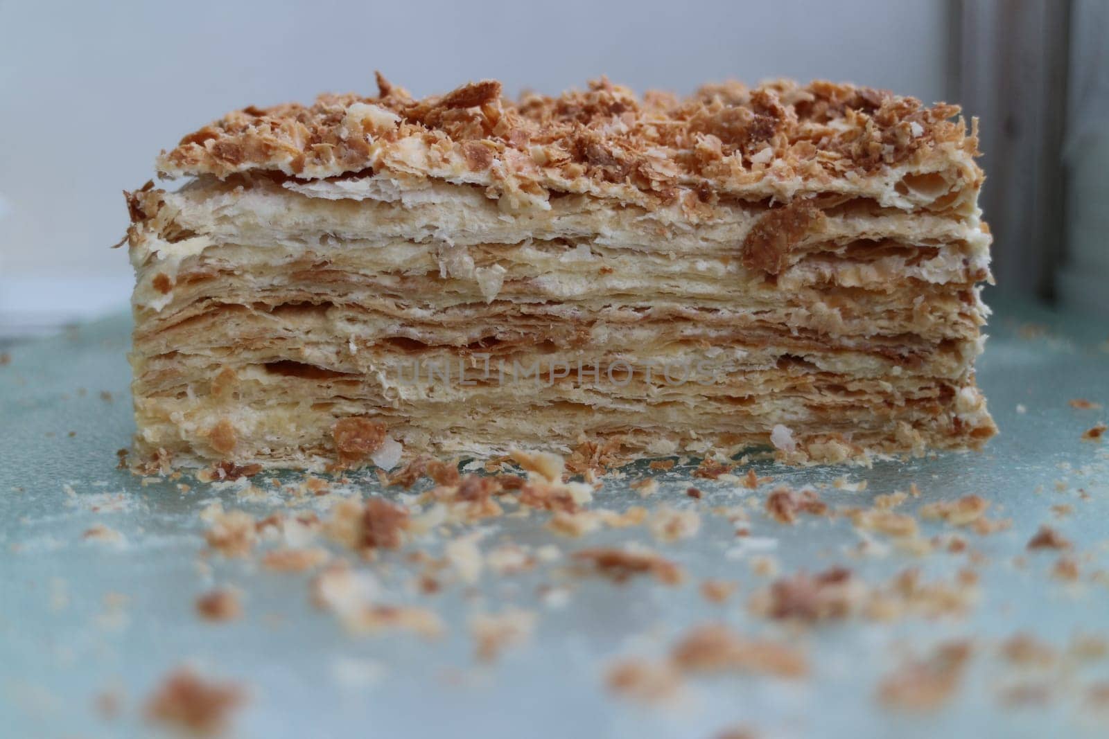 napoleon layered cake in a cut with crumbs