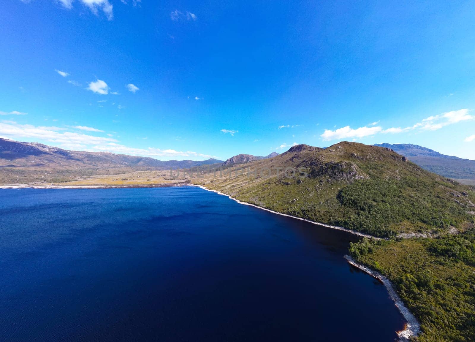 Aerial landscape of Lake Plimsoll on a hot summer's afternoon in Tasmania, Australia