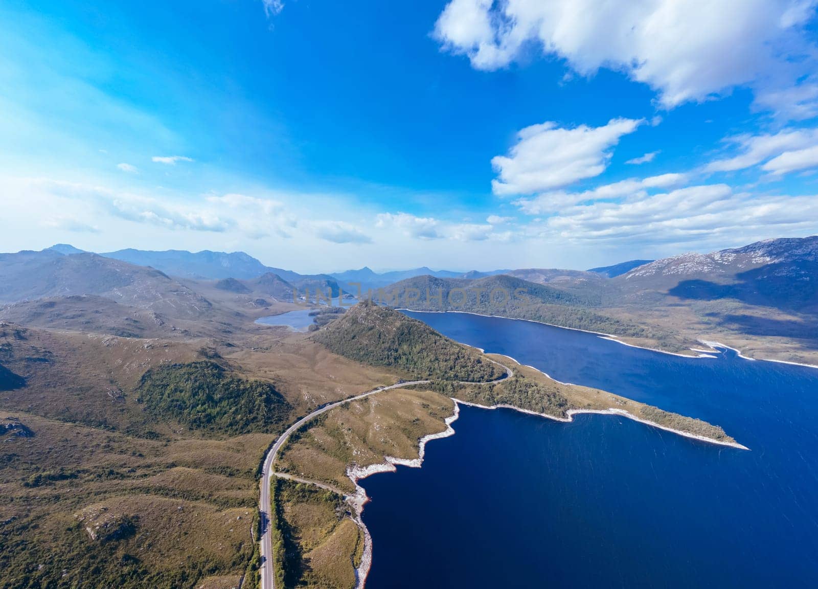 Aerial landscape of Lake Plimsoll on a hot summer's afternoon in Tasmania, Australia