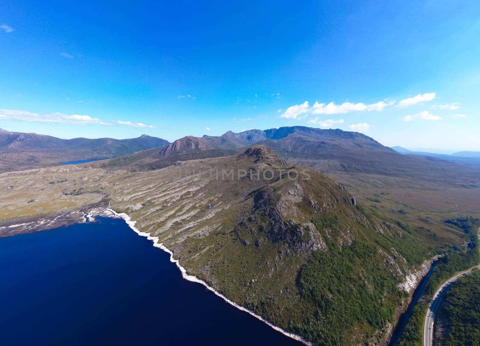 Aerial landscape of Lake Plimsoll on a hot summer's afternoon in Tasmania, Australia