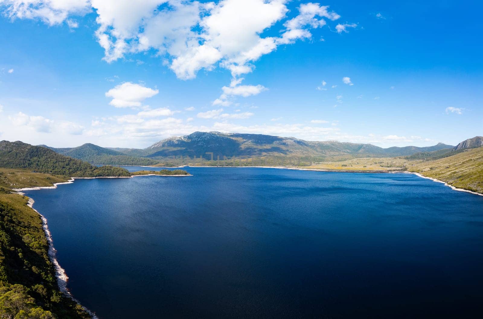 Aerial landscape of Lake Plimsoll on a hot summer's afternoon in Tasmania, Australia