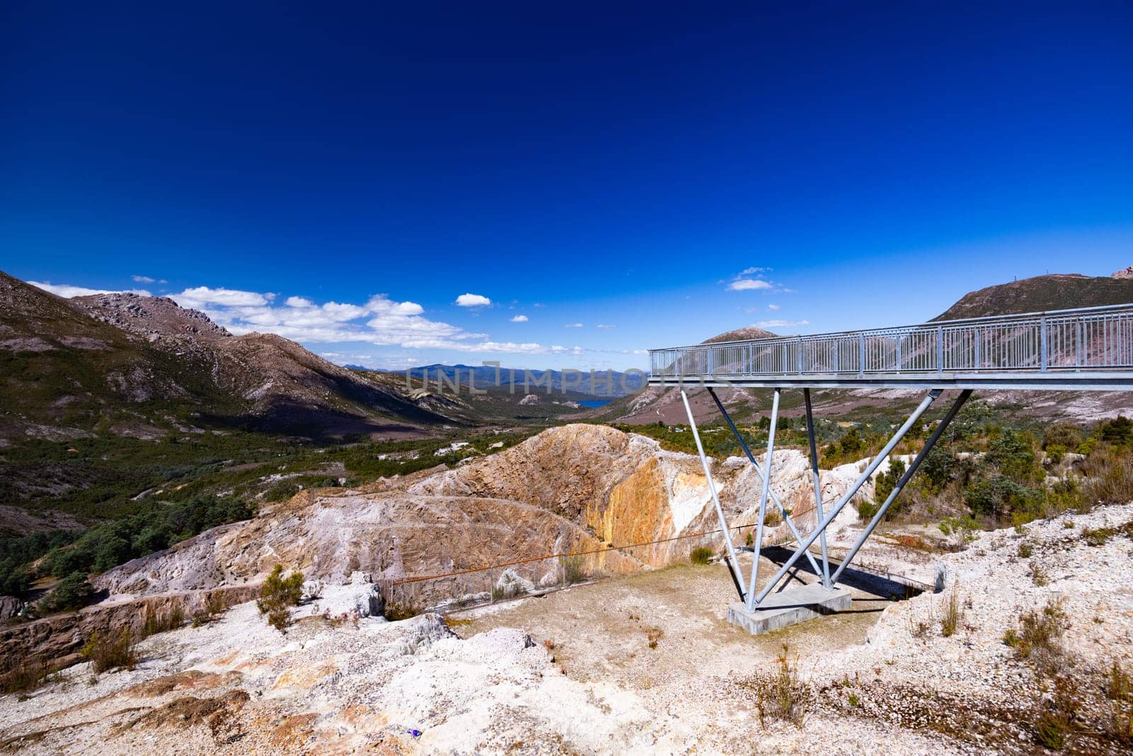 The view of Iron Blow Lookout on a hot summer's afternoon in Queenstown, Tasmania, Australia