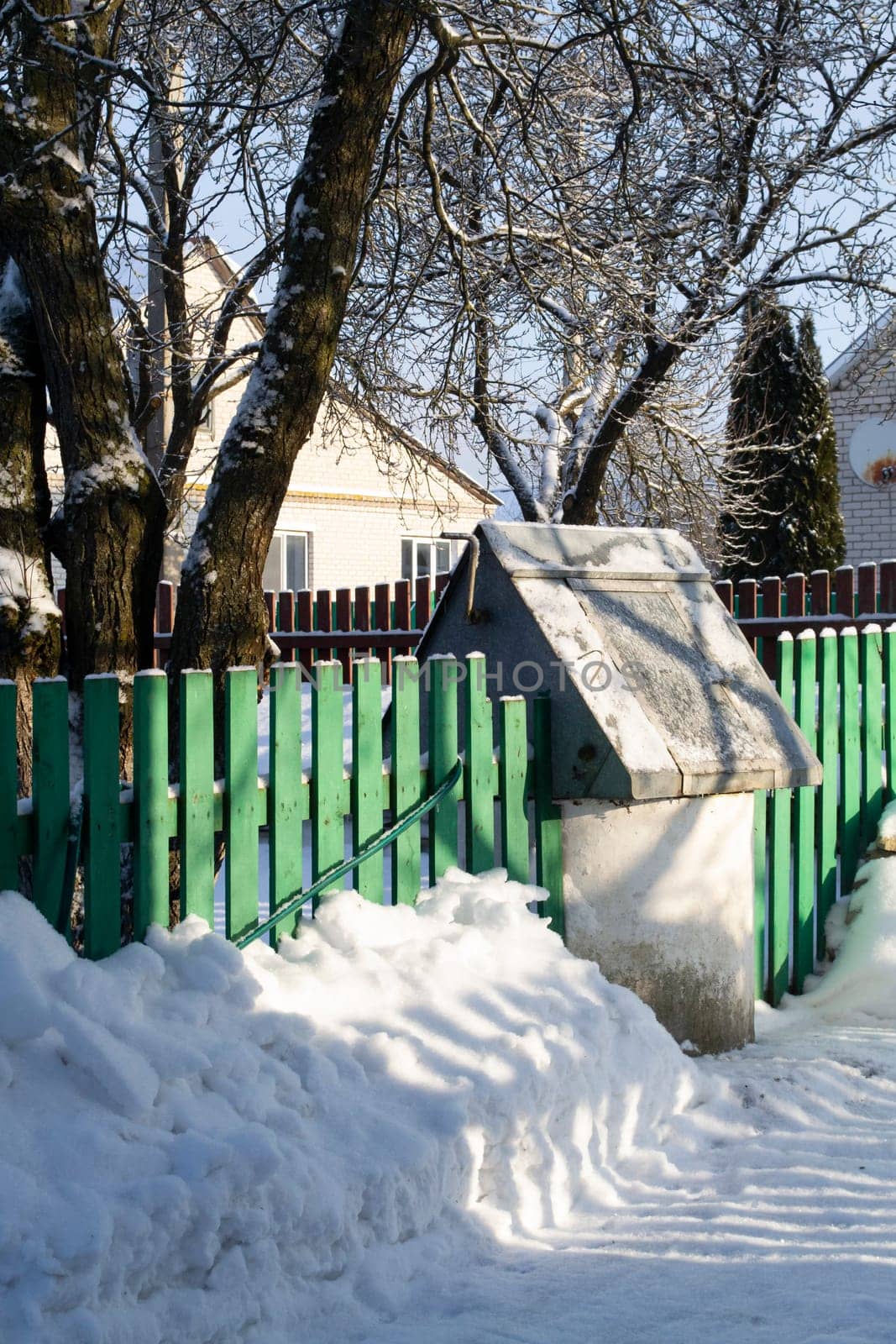 The village has good water views. Old water view of the well, winter landscape