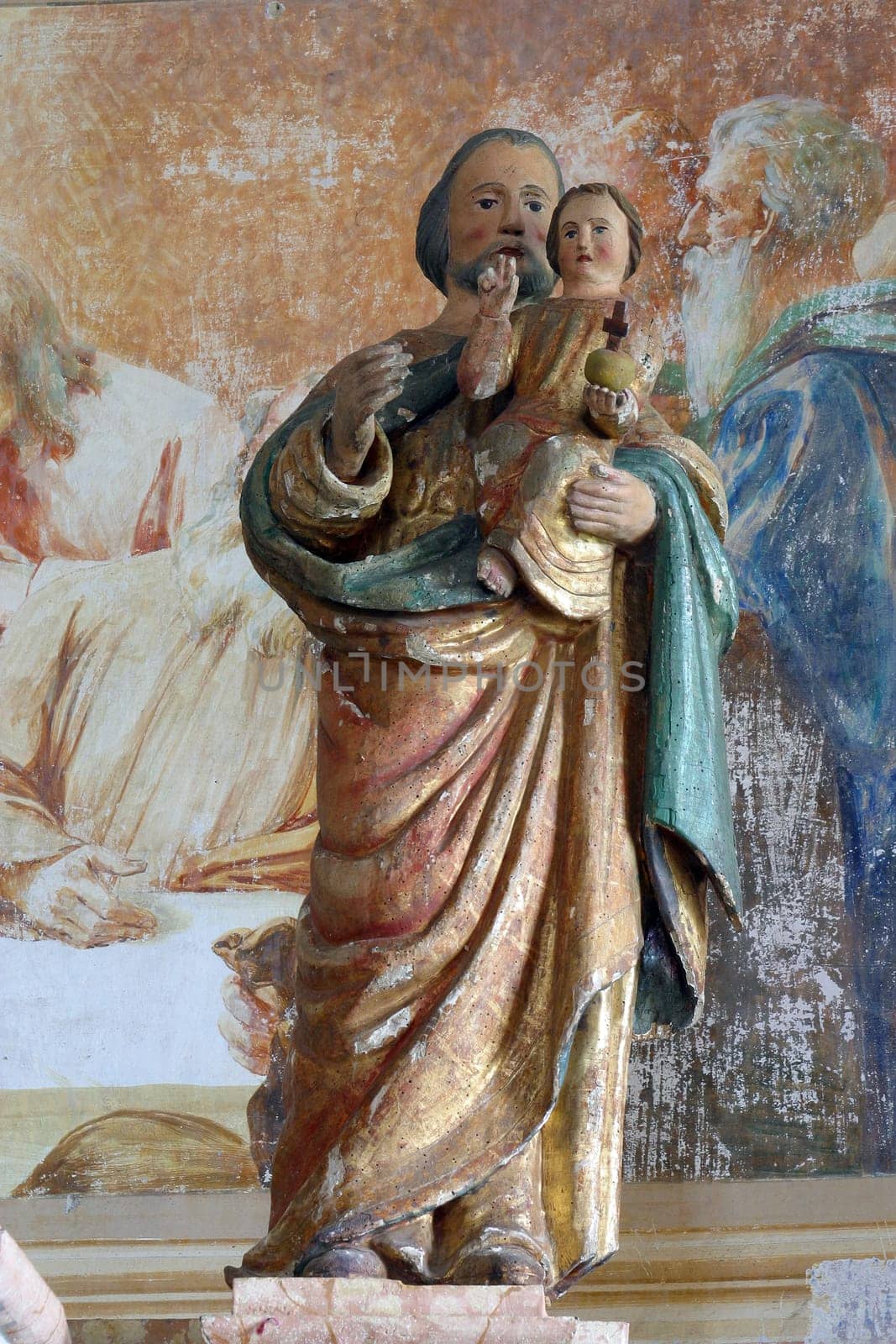 Saint Joseph holds a baby Jesus, a statue on the main altar in the chapel of Saint Anne in Desinic, Croatia