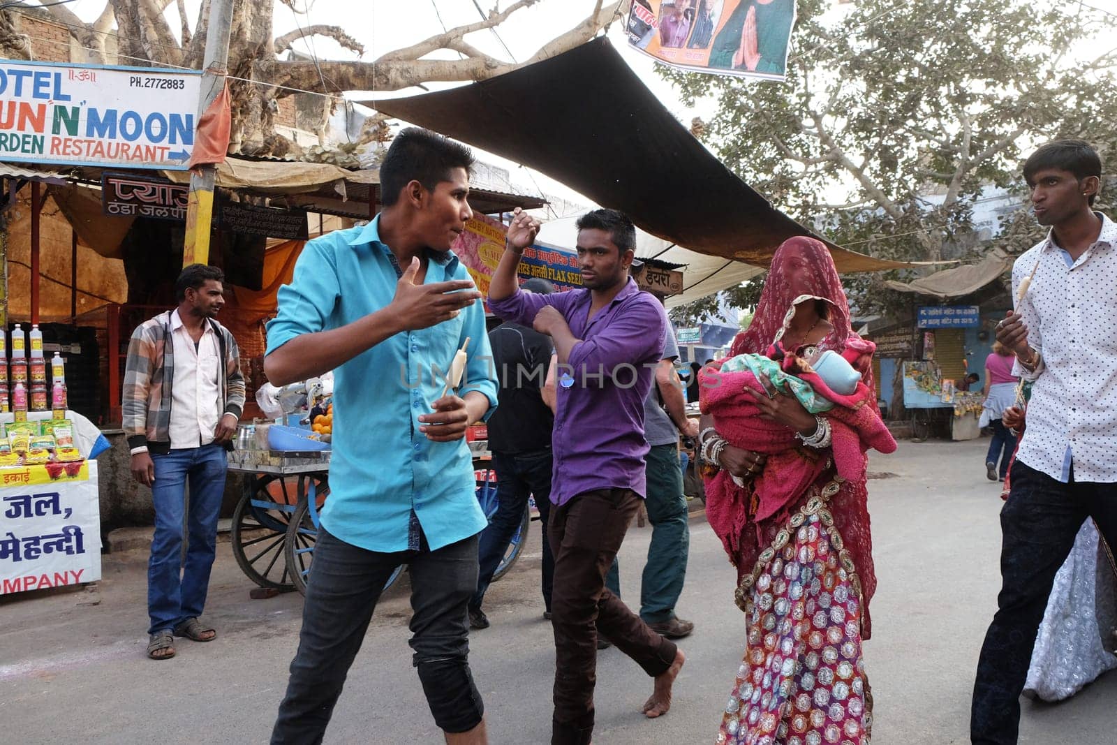 People walk around downtown in Pushkar, India. The city is one of the five sacred dhams for devout Hindus, in Pushkar, Rajasthan, India.