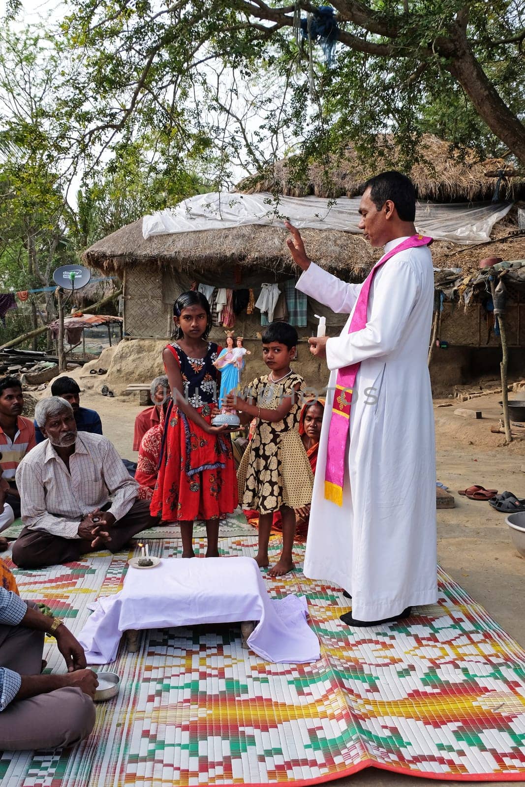 Faithful Catholics during an outdoor Mass in the village of Mitrapur, West Bengal, India