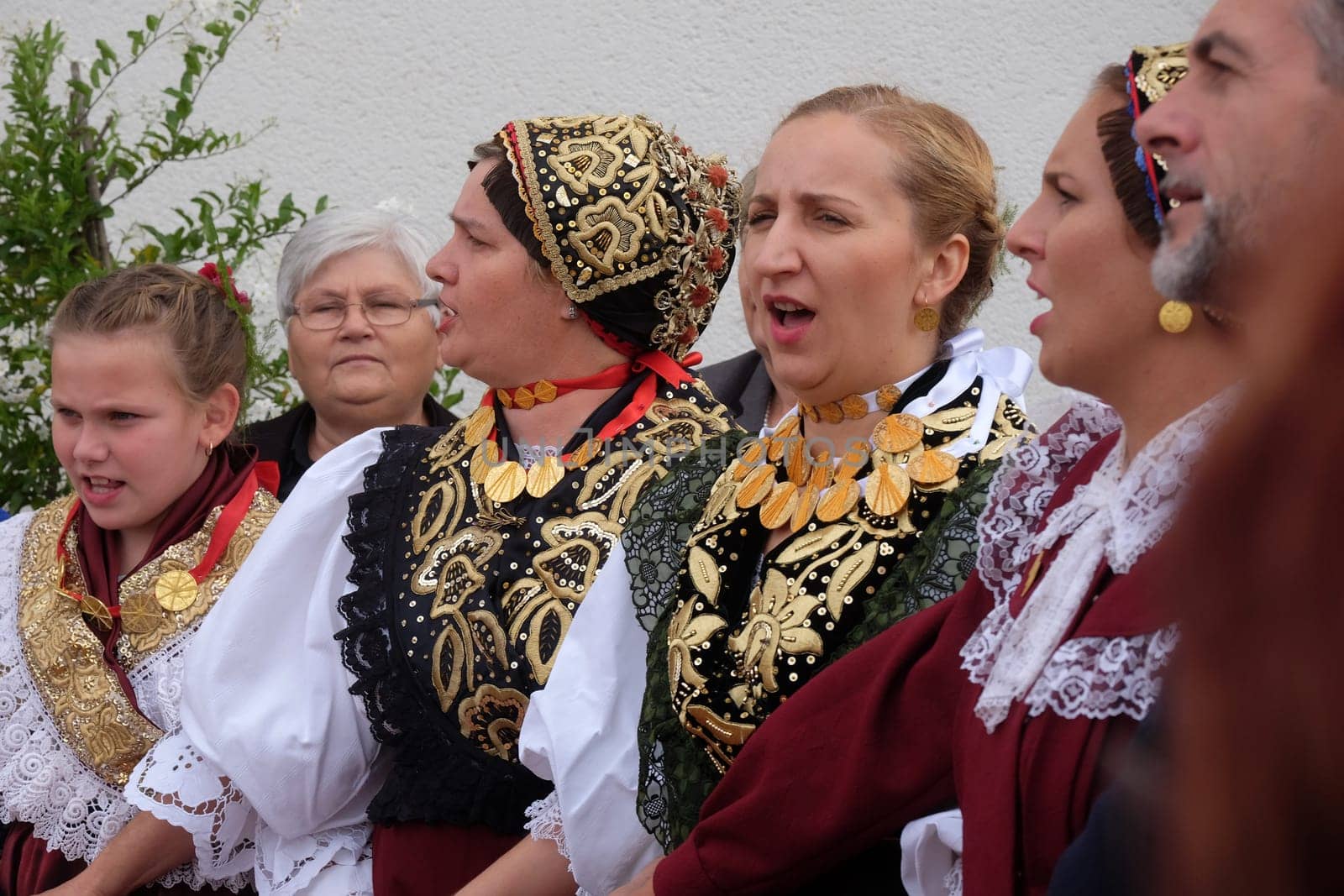 People sing and dance after the Mass on Thanksgiving day in Stitar, Croatia