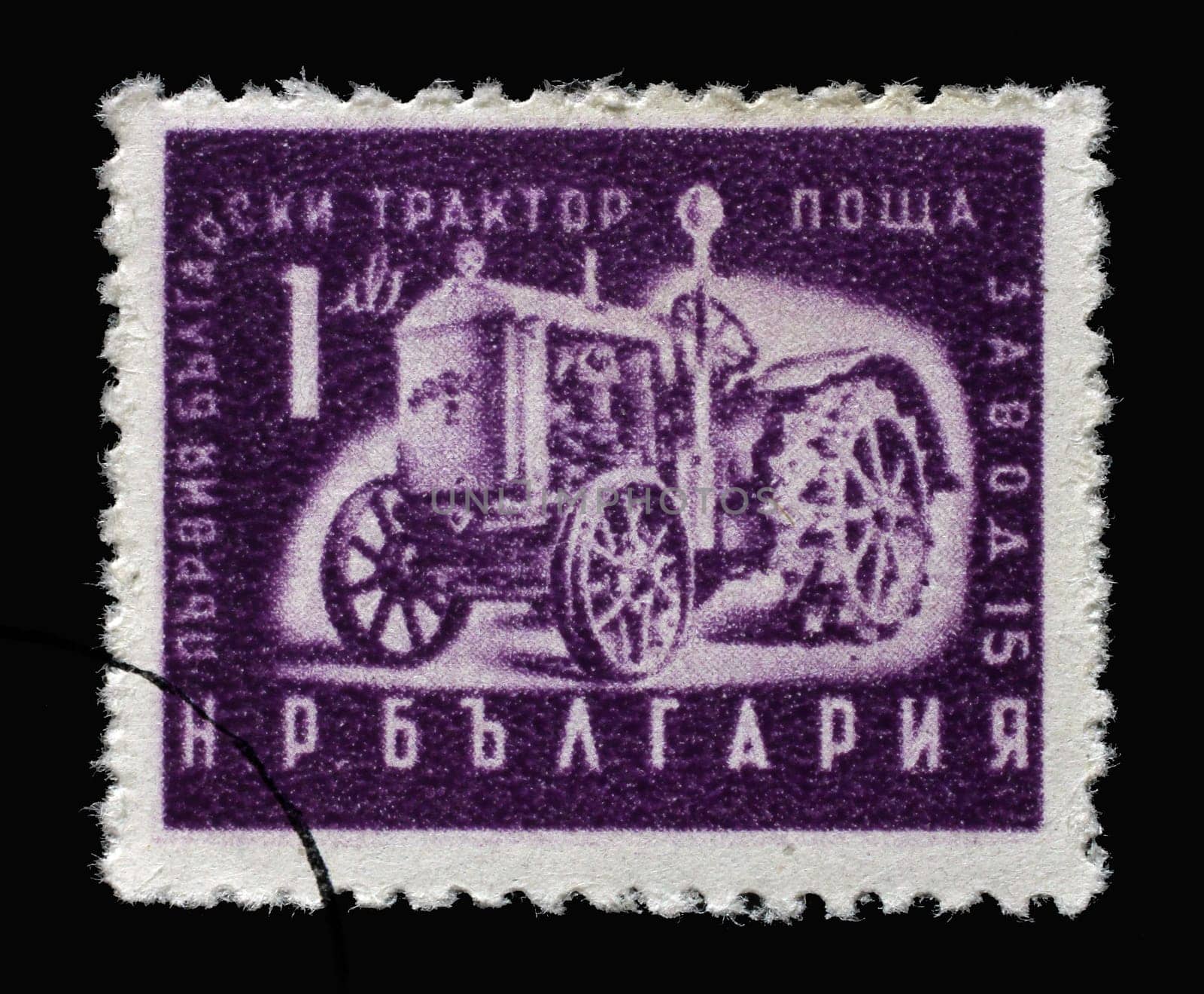 Stamp printed in Bulgaria shows first Bulgarian tractor, circa 1951