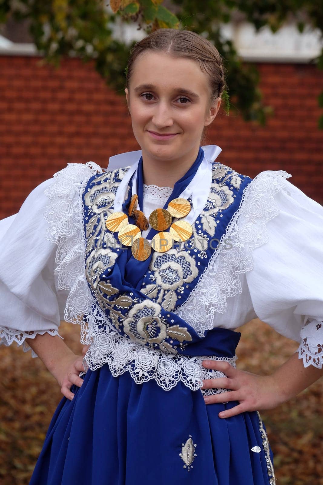 Girl dressed in folk costumes go to the church at the Mass on Thanksgiving day in Stitar, Croatia