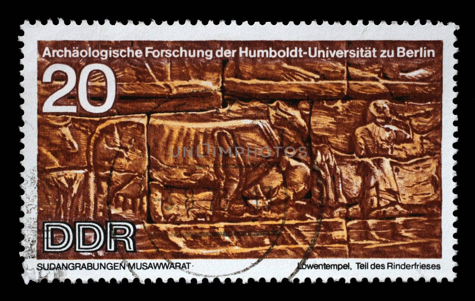 Stamp printed in GDR shows Sudanese Archaeological Excavations by Humboldt University Expedition, Part of the frieze Cattle, reproduce carvings unearthed at Lions Temple, Musawwarat, circa 1970