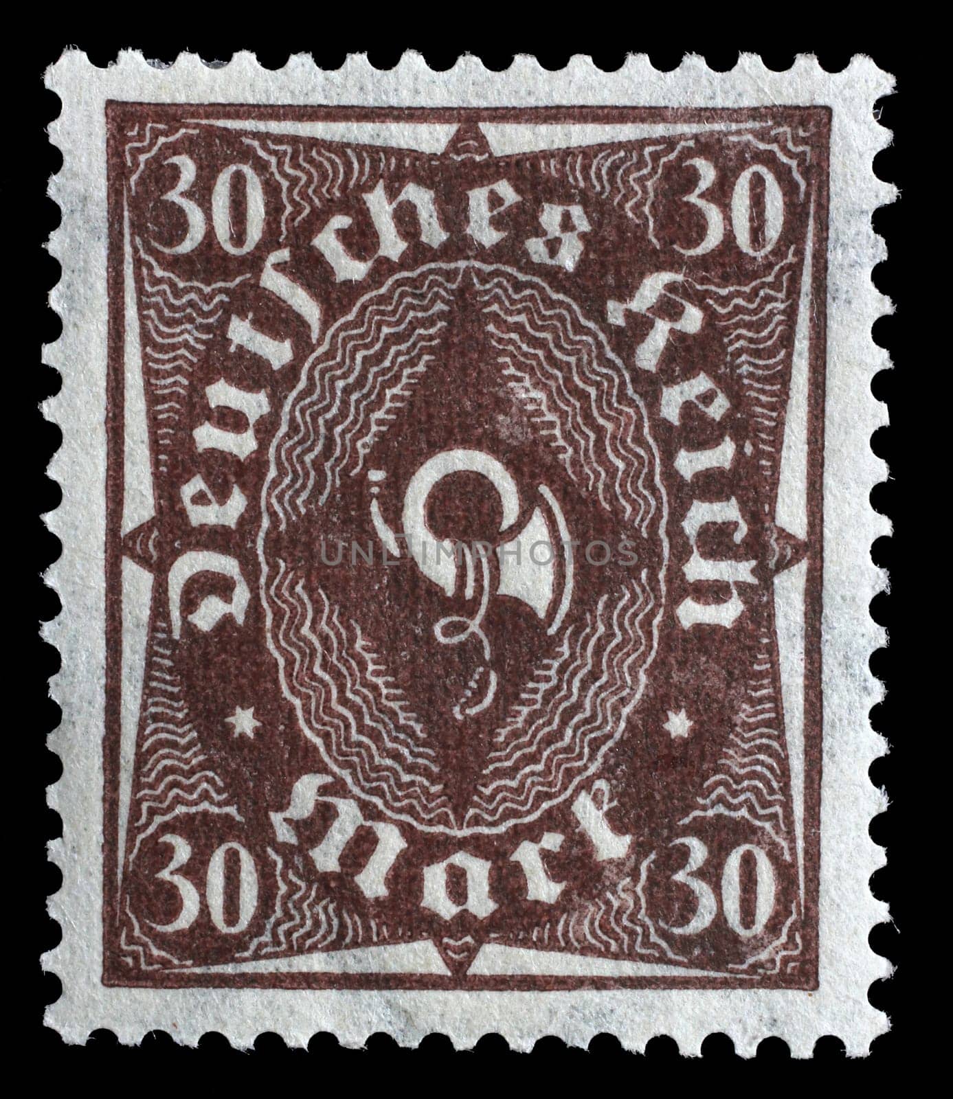 Stamp printed in Germany shows a posthorn, circa 1922.