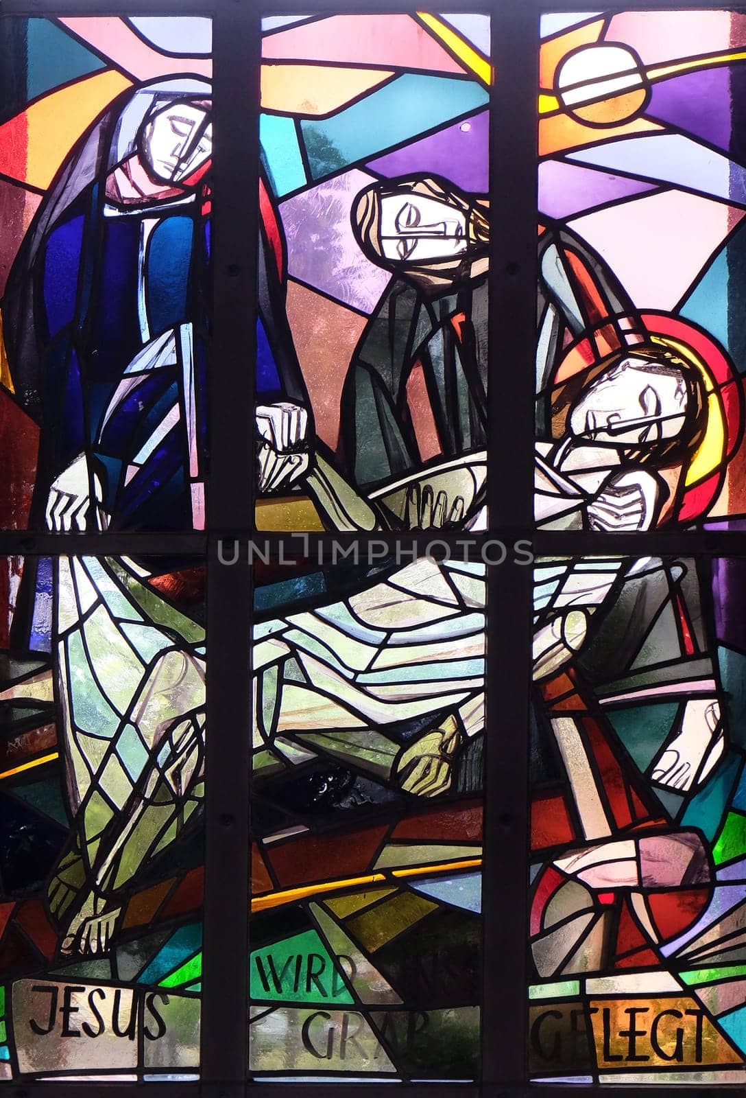 14th Stations of the Cross, Jesus is laid in the tomb and covered in incense, stained glass window in Saint Lawrence church in Kleinostheim, Germany