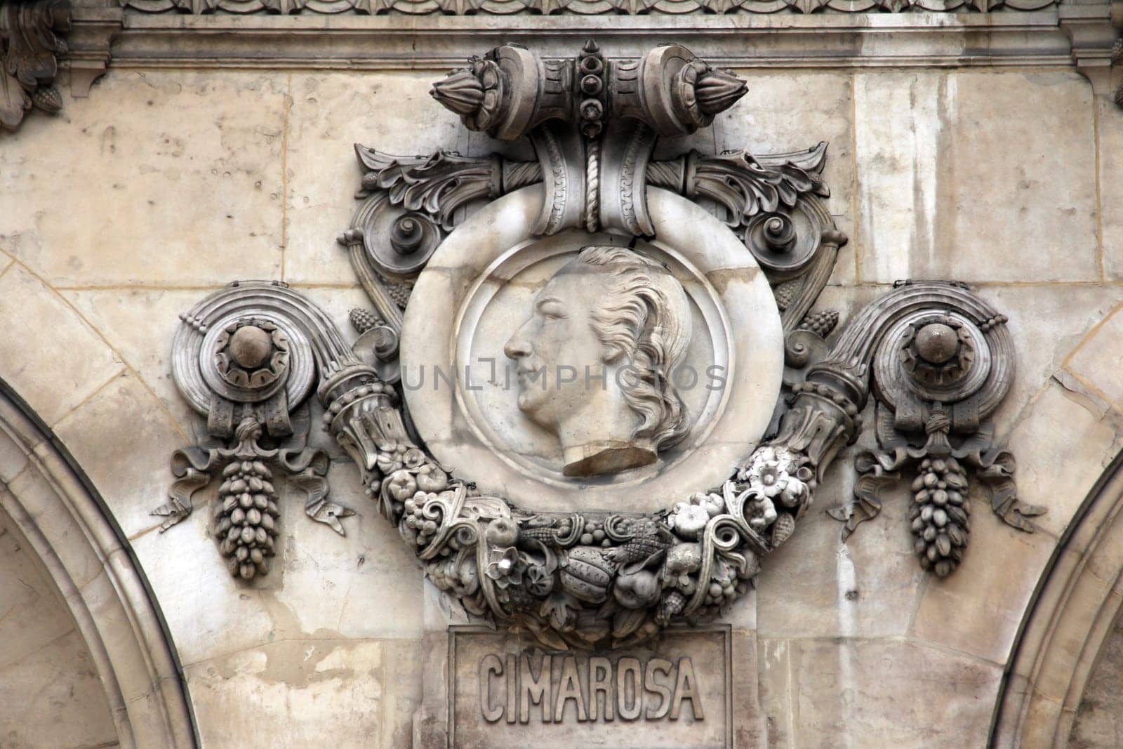 Architectural details of Opera National de Paris: Cimarosa Facade sculpture. Grand Opera (Garnier Palace) is famous neo-baroque building in Paris, France - UNESCO World Heritage Site.