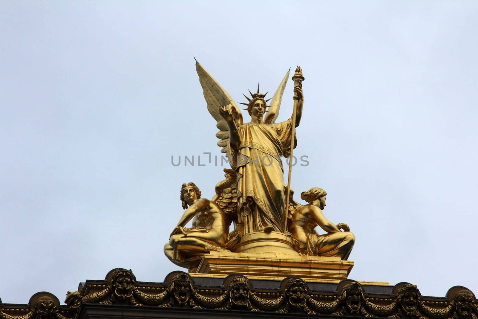 Golden statue of Angel on the top of the Garnier Opera in Paris, France (The Poetry by Charles Gumery)