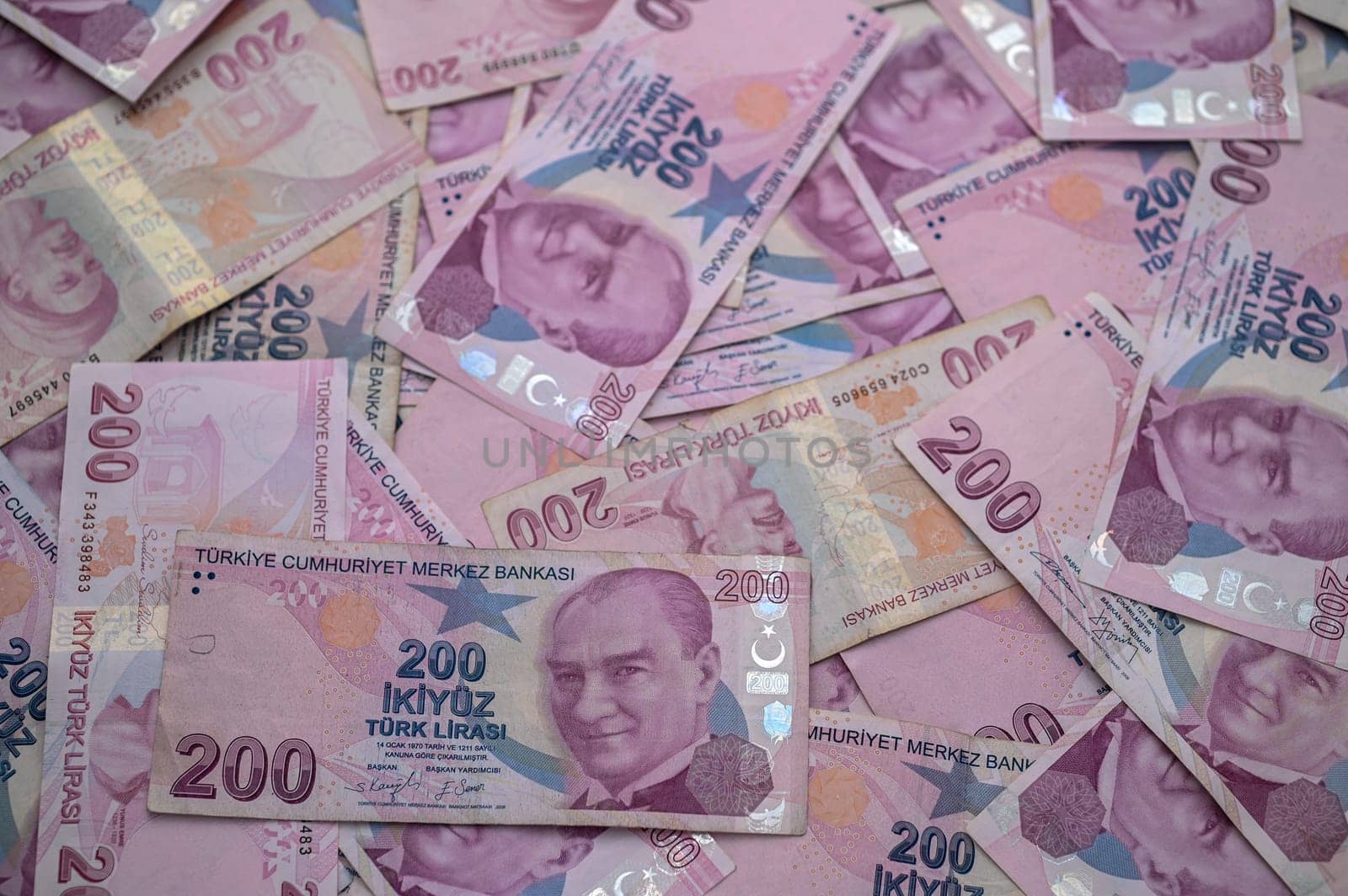 A vibrant collection of Turkish lira notes creatively scattered, highlighting wealth and currency diversity.