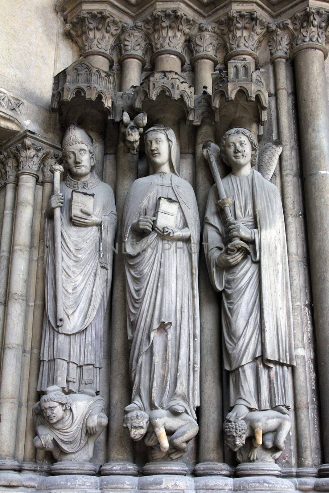 Medieval gothic statues on entry to Eglise St. Germain l'Auxerrois in Paris, France.