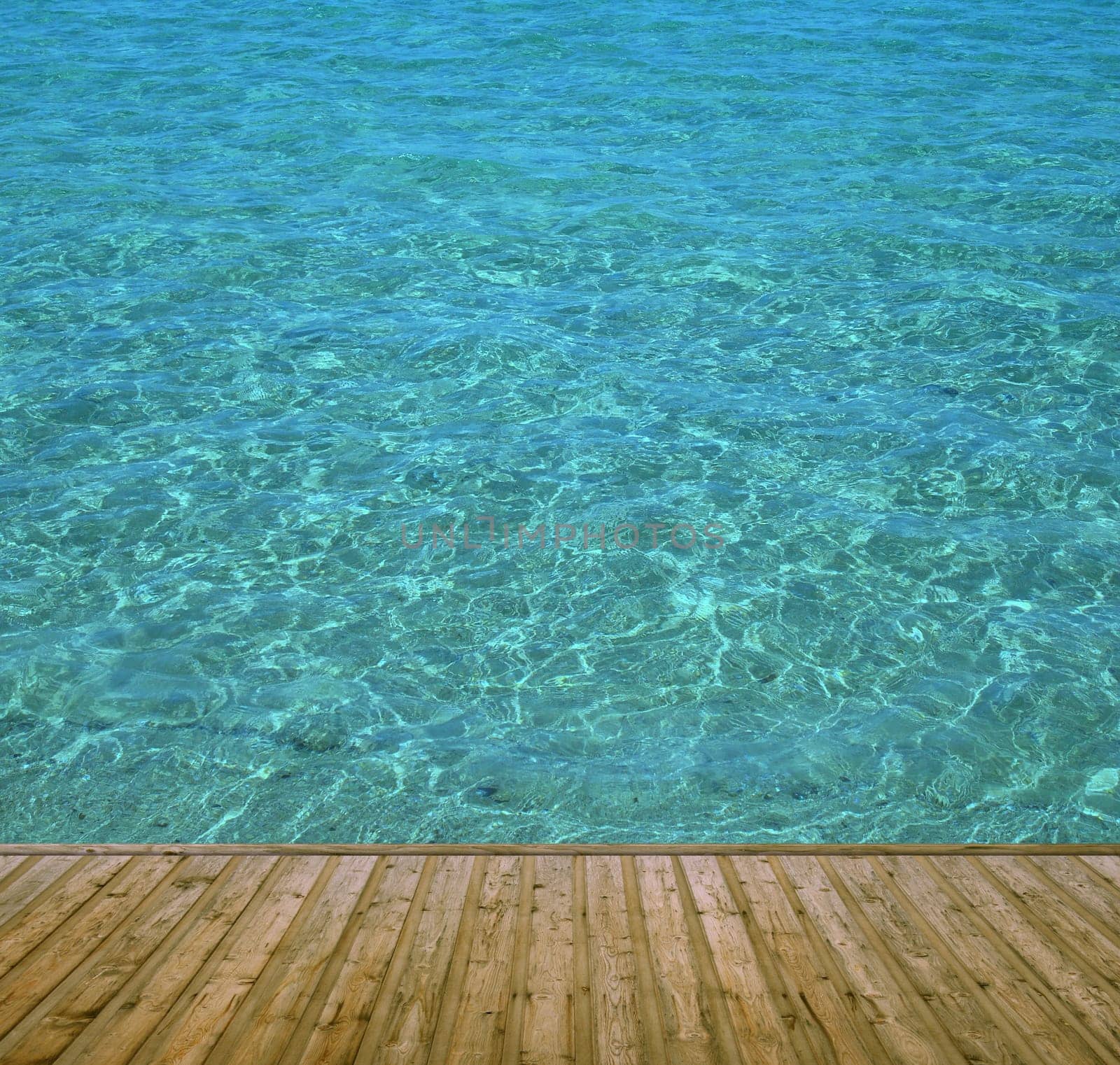 Wooden bathing jetty with clear blue water