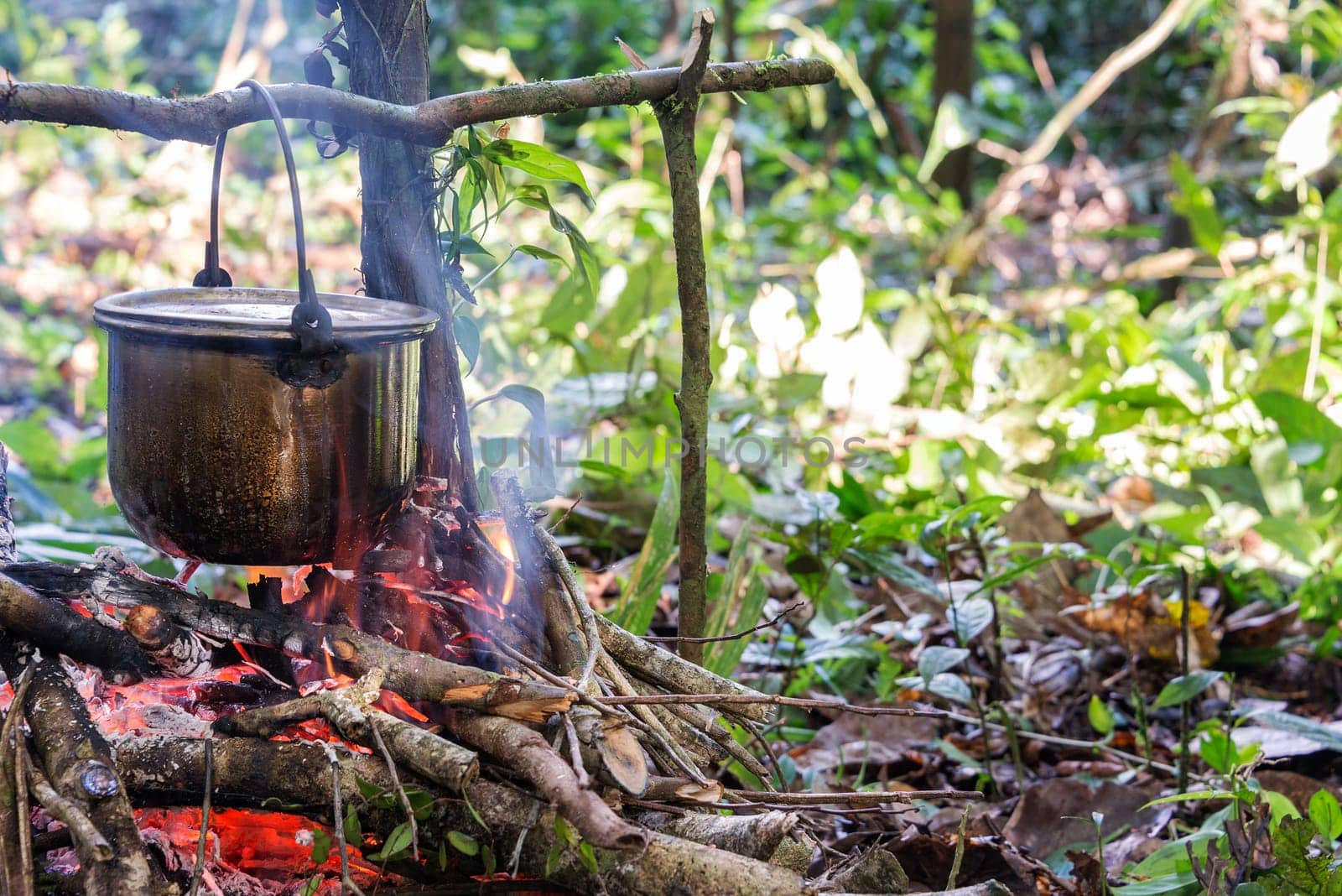 Cooking food at a campsite deep within the Amazon rainforest in Peru