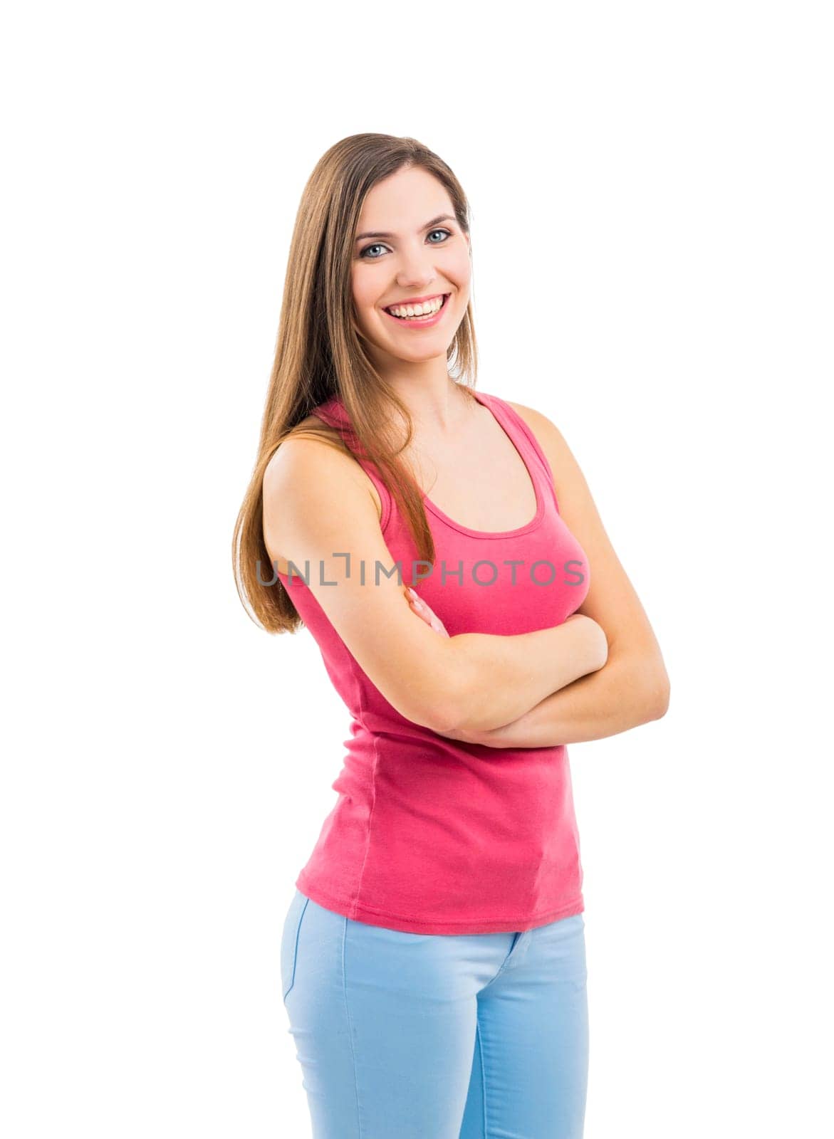 Beautiful brunette woman laughing and pointing to the side, isolated over white background