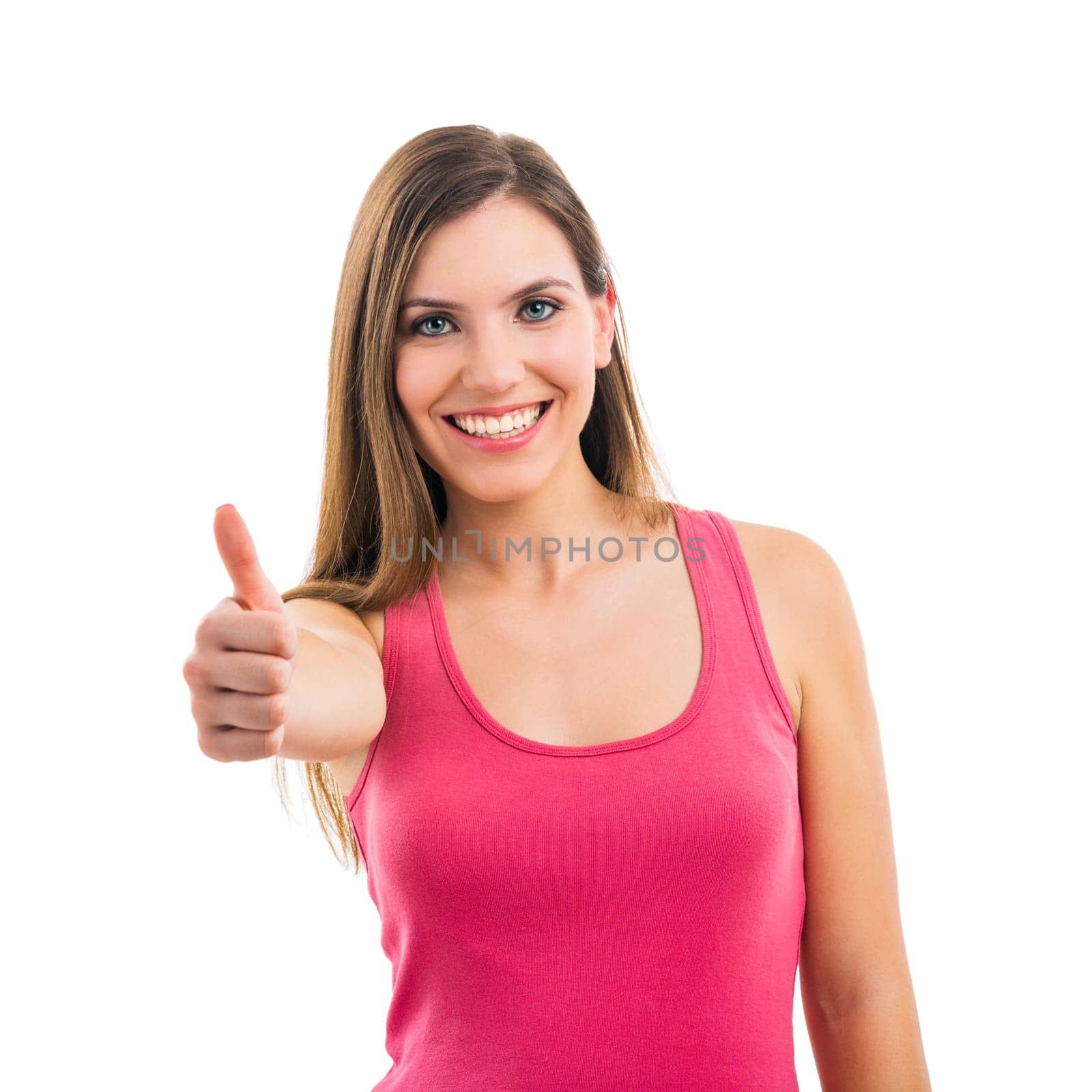 Beautiful brunette woman laughing and pointing to the side, isolated over white background