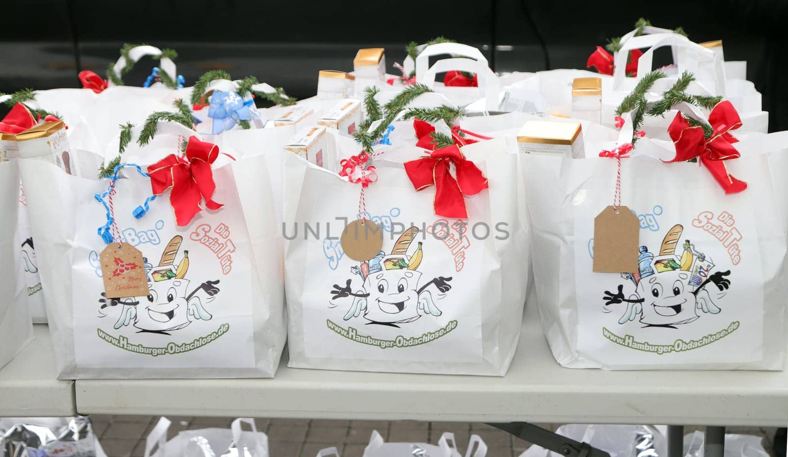 Yasmina Filali, german actress and model , Max Bryon and Crew distributed Christmas bags from Hamburger Homeless Aid e.V. to the homeless and needy at Hamburg Central Station