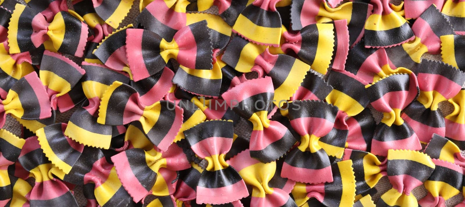 Italian pasta background. Pasta Farfalle top view, flat lay. Colourful Italian food