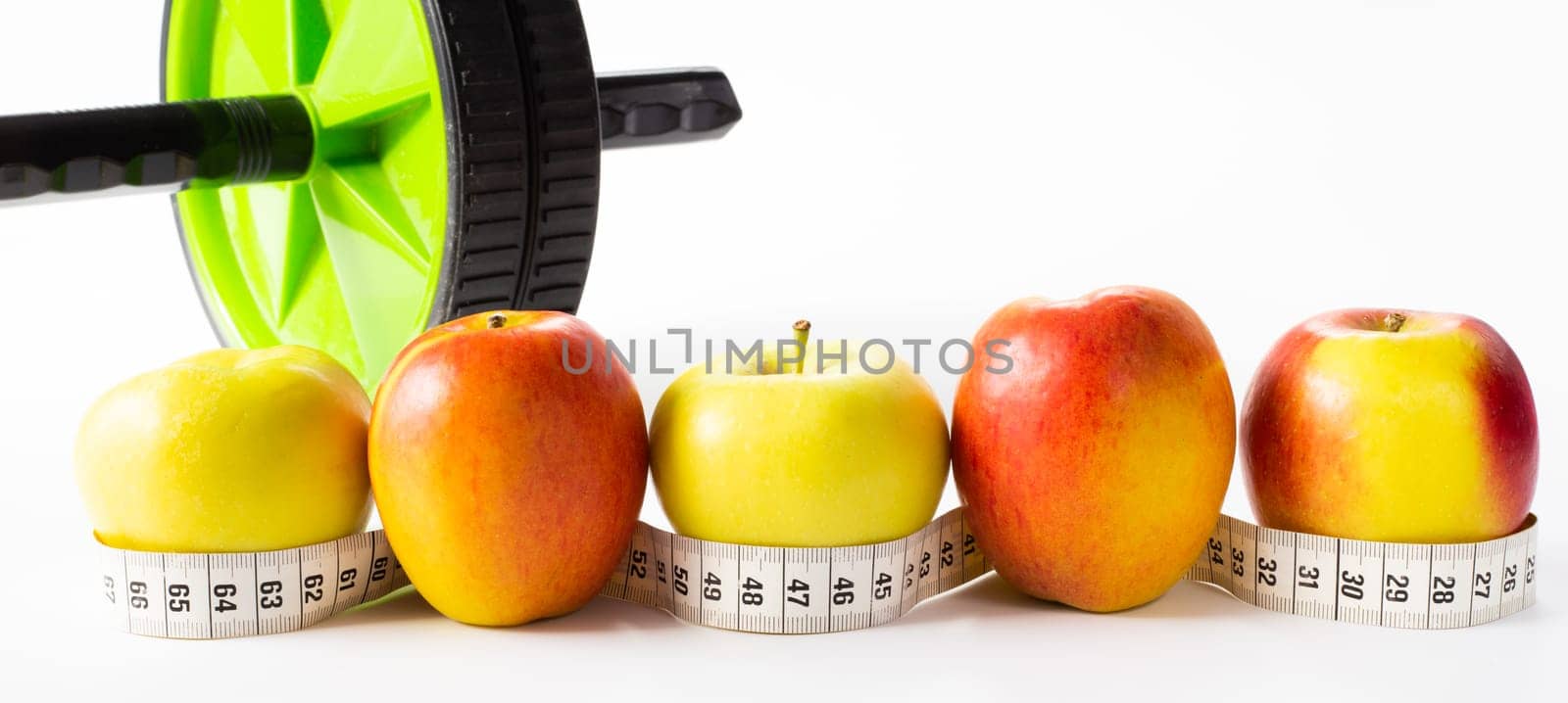 Healthy lifestyle, fitness, fruits, sport, athlete's equipment on white background. Copy space.