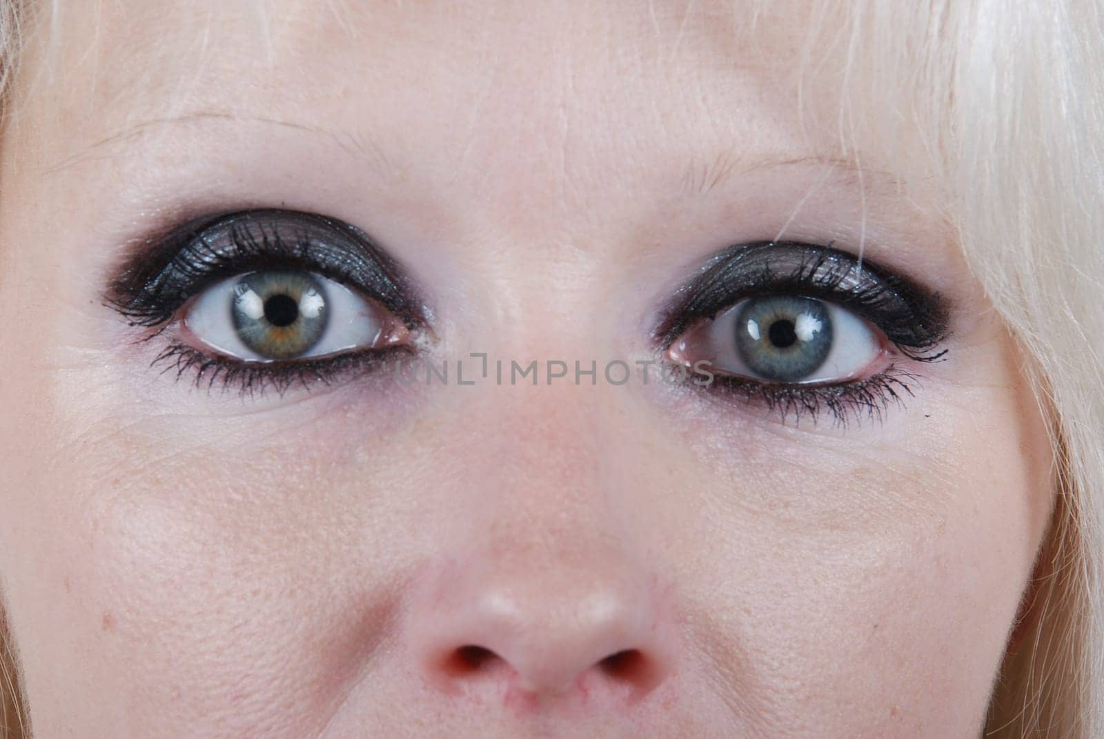 Close up the eyes of a young blond woman